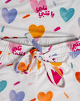 Close-up of our Albi Long Sleeve Pyjama, featuring a playful heart print and the Arabic phrase "يا قلبي" for a sweet bedtime touch.