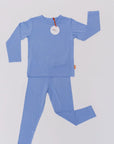 Our Bahry Long Sleeve Kids Pyjama laid flat, showcasing the soft bamboo fabric and minimalist blue design made for ultimate comfort.