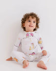 A baby wearing our Reef Pyjama, cozy in its timeless solid tone and buttery-soft bamboo fabric.