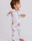 A baby wearing our Bosta Pyjama, exploring freely in soft bamboo comfort and vibrant Lebanese-inspired prints.