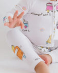 A close-up of our Bosta Pyjama, featuring playful bus prints and cultural details inspired by Lebanon’s nostalgic charm.