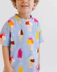 A cheerful boy wearing our Boza Loungewear set, featuring playful ice cream prints that bring summer vibes to life.