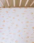 Harakat fitted crib sheet from Nohm store, stylish and cozy Arabic crib sheet, great for baby gifts in Dubai.