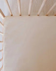 A close-up of our Nohm Ramly Crib Sheet, perfectly fitted for a snug and serene sleep space.