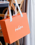 Nohm store gift packaging for kids and baby clothes from dubai.