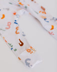 Huroof baby pyjama from Nohm store, Arabic letter-inspired pyjama, perfect for children and baby gifts in Dubai.