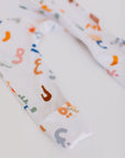 Huroof baby pyjama from Nohm store, Arabic letter-inspired pyjama, perfect for children and baby gifts in Dubai.