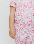 A close-up of our Amira Short Sleeve Pyjama, featuring delicate princess and castle prints for a dreamy bedtime look.

