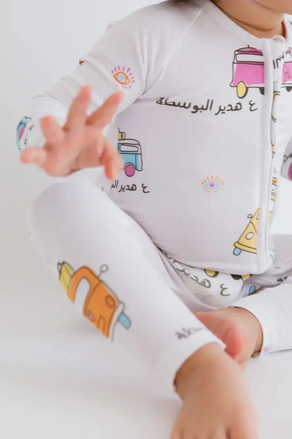 A close-up of our Bosta Pyjama, featuring playful bus prints and cultural details inspired by Lebanon’s nostalgic charm.