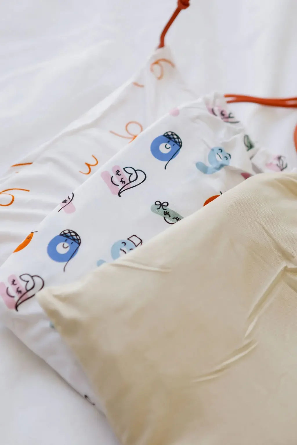 Our CloudSoft™ Crib Sheet Set — a trio of ultra-soft bamboo sheets blending cultural charm and calming neutral tones for a dreamy nursery.