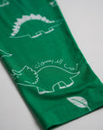 Close-up of our Dinosaur Pyjama sleeve, featuring playful white dinosaur illustrations and Arabic text on soft green bamboo fabric.