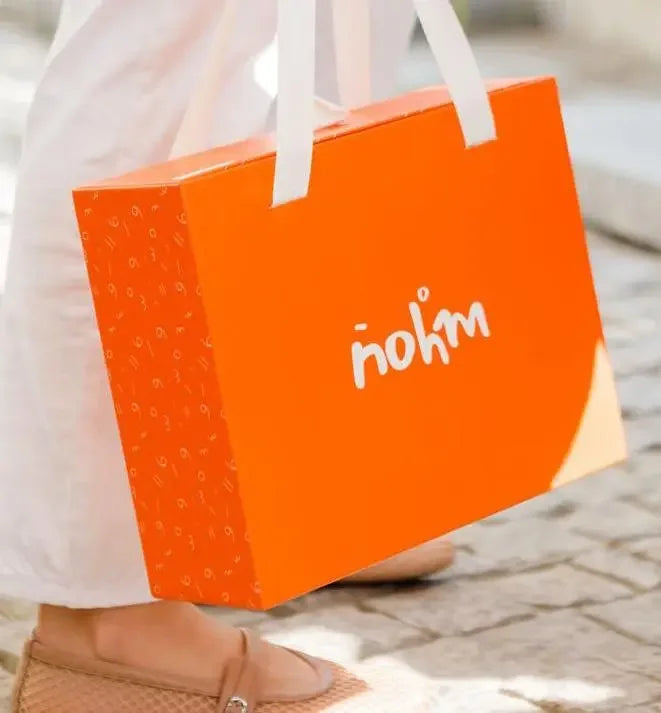 Nohm store gift packaging for kids and baby clothes gifts from dubai.