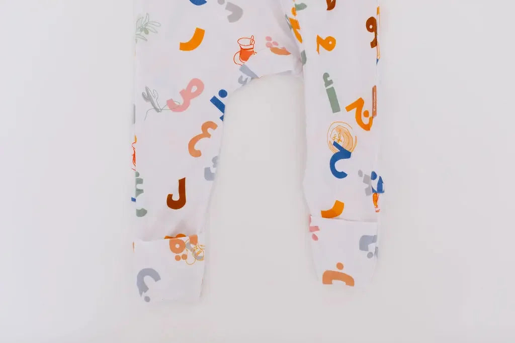 Huroof baby pyjama from Nohm store, Arabic letter-inspired pyjama, perfect for children and baby gifts in Dubai.