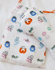 Our Nohm Tanween Bedding Set — a soft, breathable bamboo collection featuring cheerful Arabic-inspired prints for a cozy and colorful nursery.