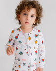 A toddler wearing the **Watermelon Pyjama** from the **Watermelon Bundle**, featuring a white base with bright watermelon-inspired fruit prints for a fun and cheerful look.
