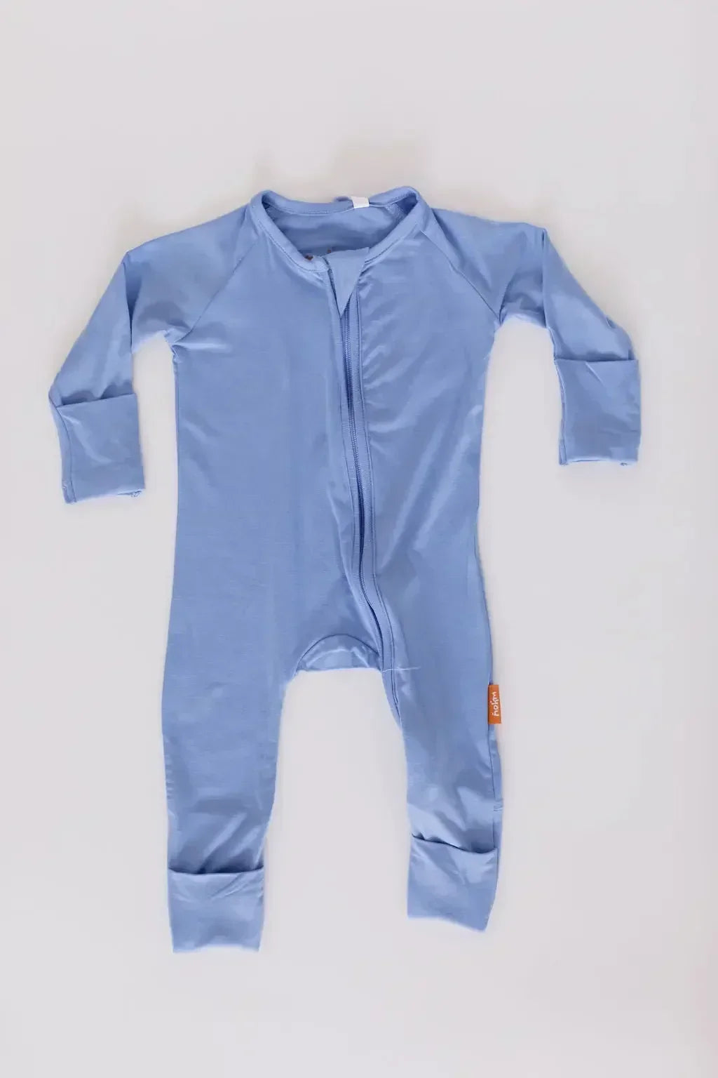 The **Bahry Pyjama** from the **Watermelon Bundle**, a soft light-blue one-piece made from breathable bamboo fabric designed for comfort, flexibility, and easy movement.

