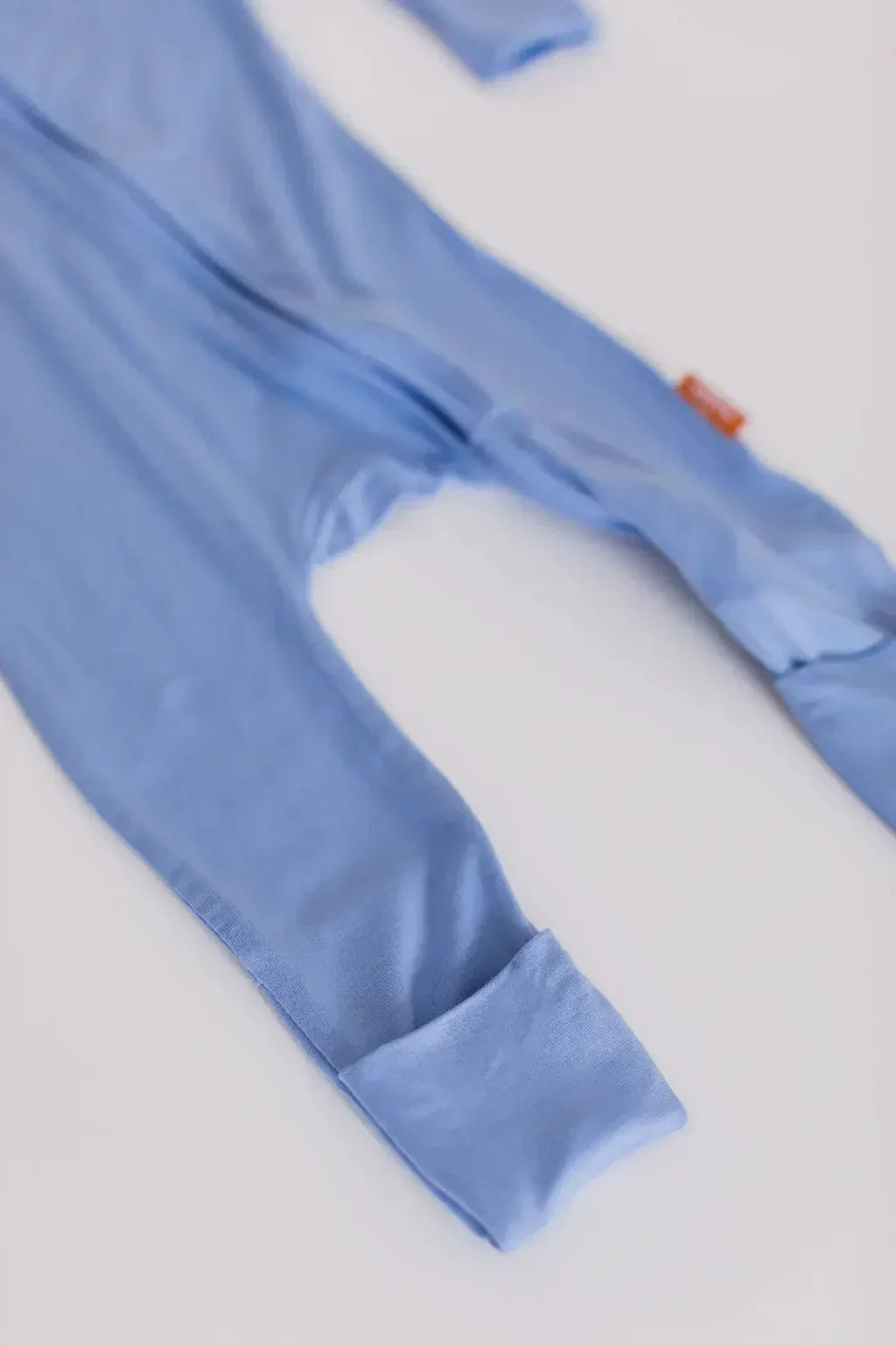 A close-up of the **Bahry Pyjama** from the **Watermelon Bundle**, highlighting its soft light-blue bamboo fabric and foldable foot cover for adjustable comfort.
