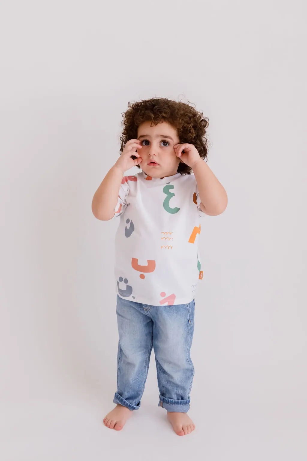Huroof t-shirt from Nohm store, Arabic letter-inspired stylish t-shirt, perfect for children and gifts from Dubai.